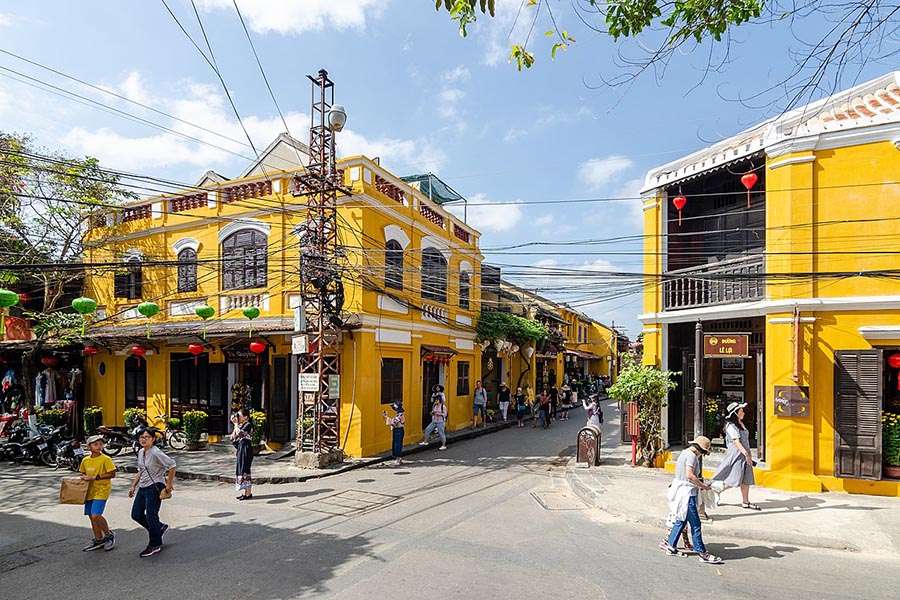 Walking through Hoi An ancient town - Hoi An day tours